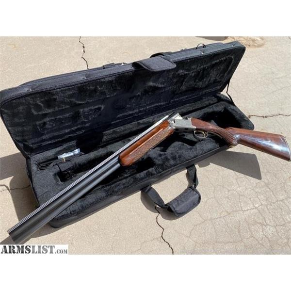 22 Winchester NIKKO shadow 12 gauge over under 27 inch " barrel
