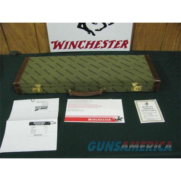 7366 Winchester 23 Classic 410 gauge 26 barrels mod full, vent rib, ejectors, single select trigger, butt pad, all original, gold raised relief Quail on bottom of receiver, initials in oval.AAA++ fancy heavily figured walnut. loo